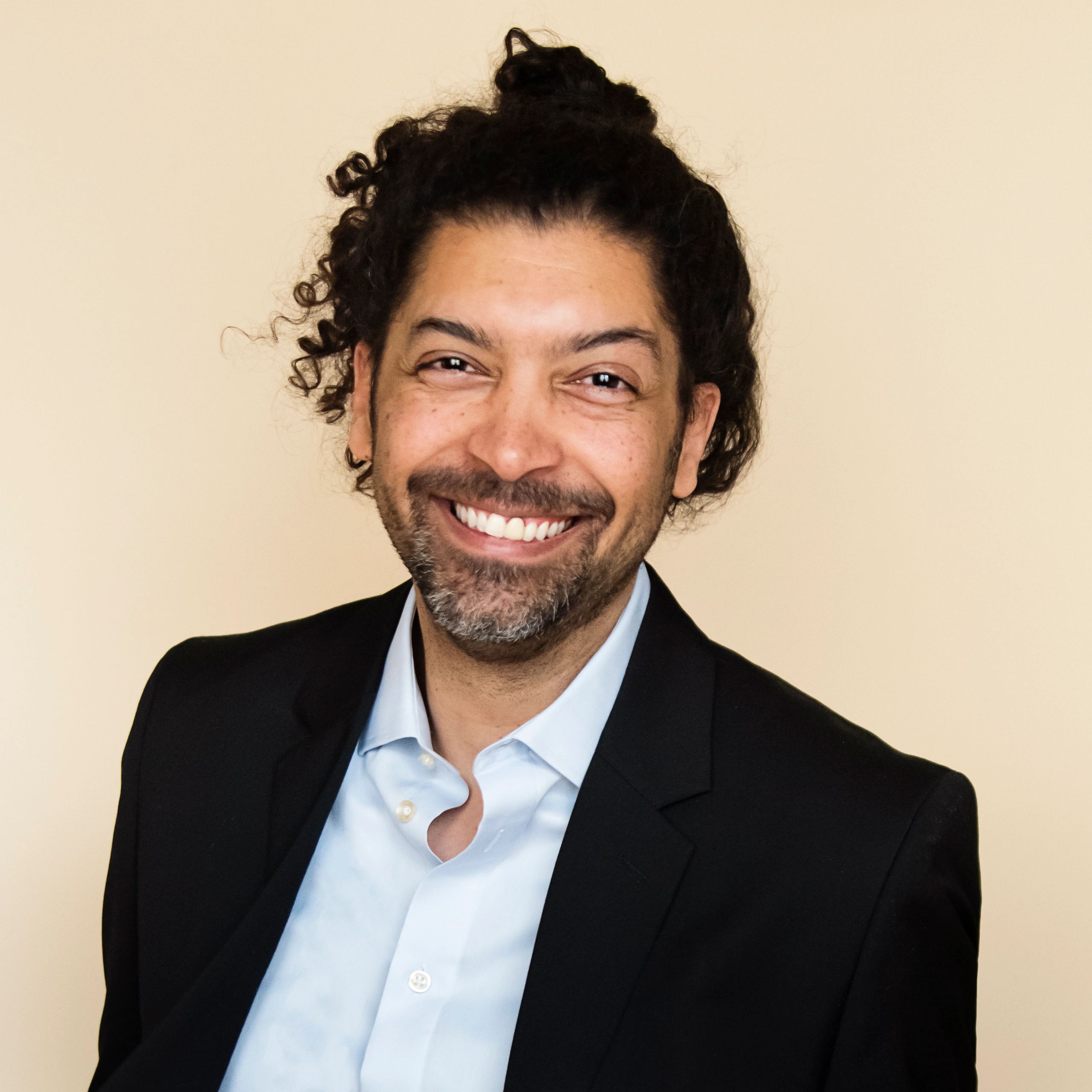 Professional headshot of a real estate agent