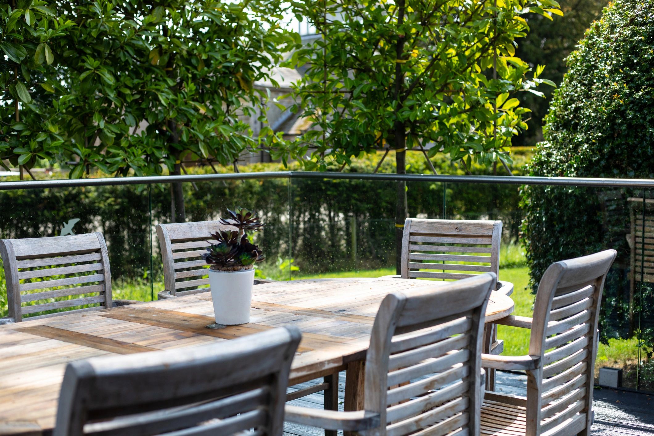 Outdoor patio seating area in a landscaped garden